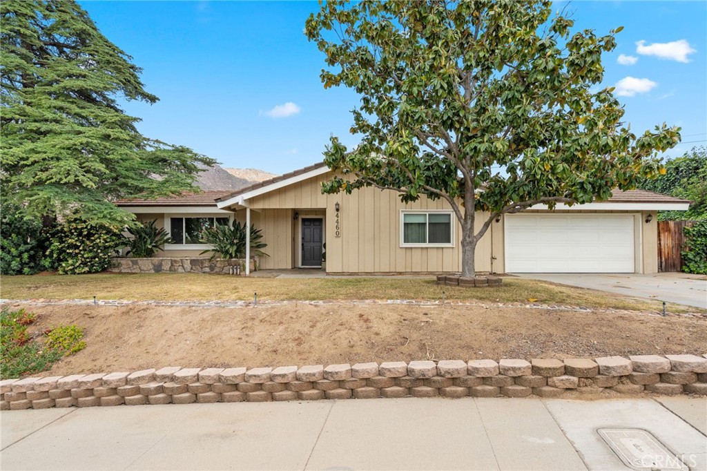 4460 Picacho Drive Riverside, CA 92507 - Photo 1 of 1 a house with trees in the background