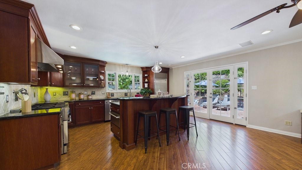 340 Toyon Road Sierra Madre, CA 91024 - Photo 10 of 60 View of the open kitchen that opens into the eating area and overlooks the living room. French doors lead to the patio area and pool.