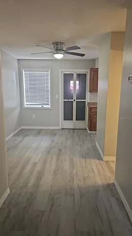 a view of livingroom with hardwood floor and ceiling fan