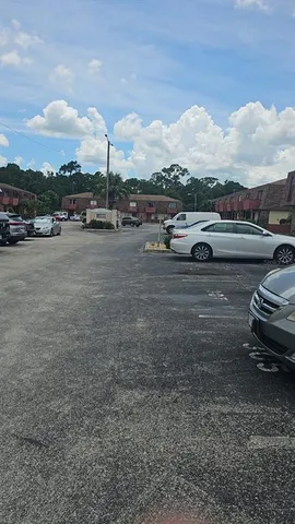 a view of street with parked cars