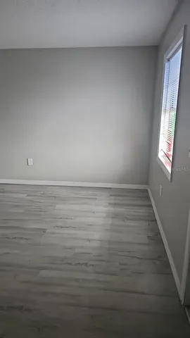 a room with an empty space and window