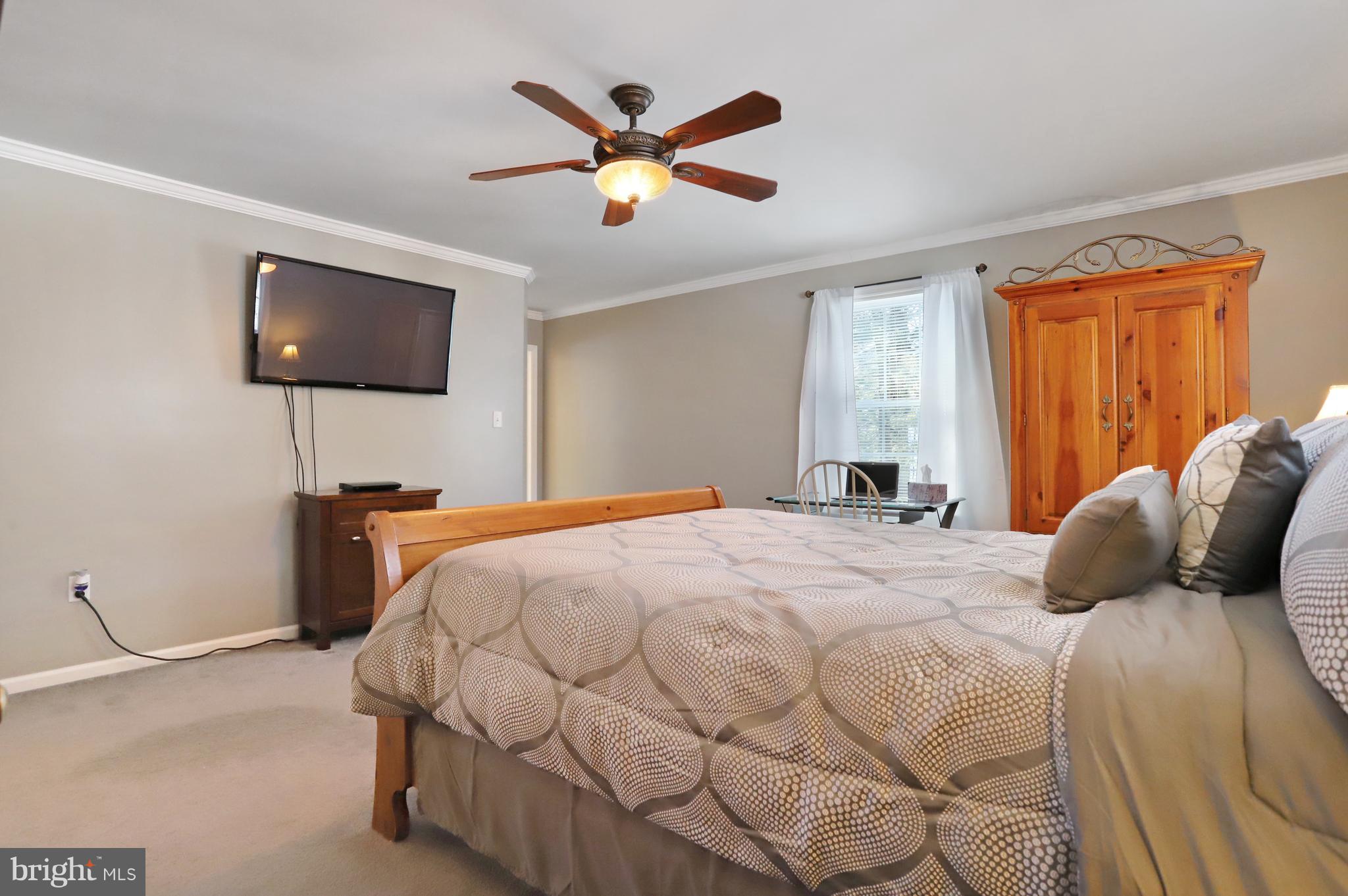 12315 Forrest Hill Road Clear Spring, MD 21722 - Photo 14 of 37 a bedroom with a bed and a flat screen tv