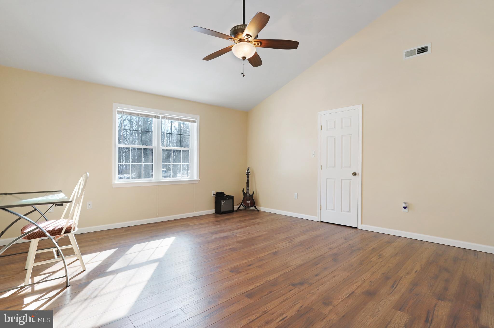 12315 Forrest Hill Road Clear Spring, MD 21722 - Photo 22 of 37 wooden floor in an empty room with a window