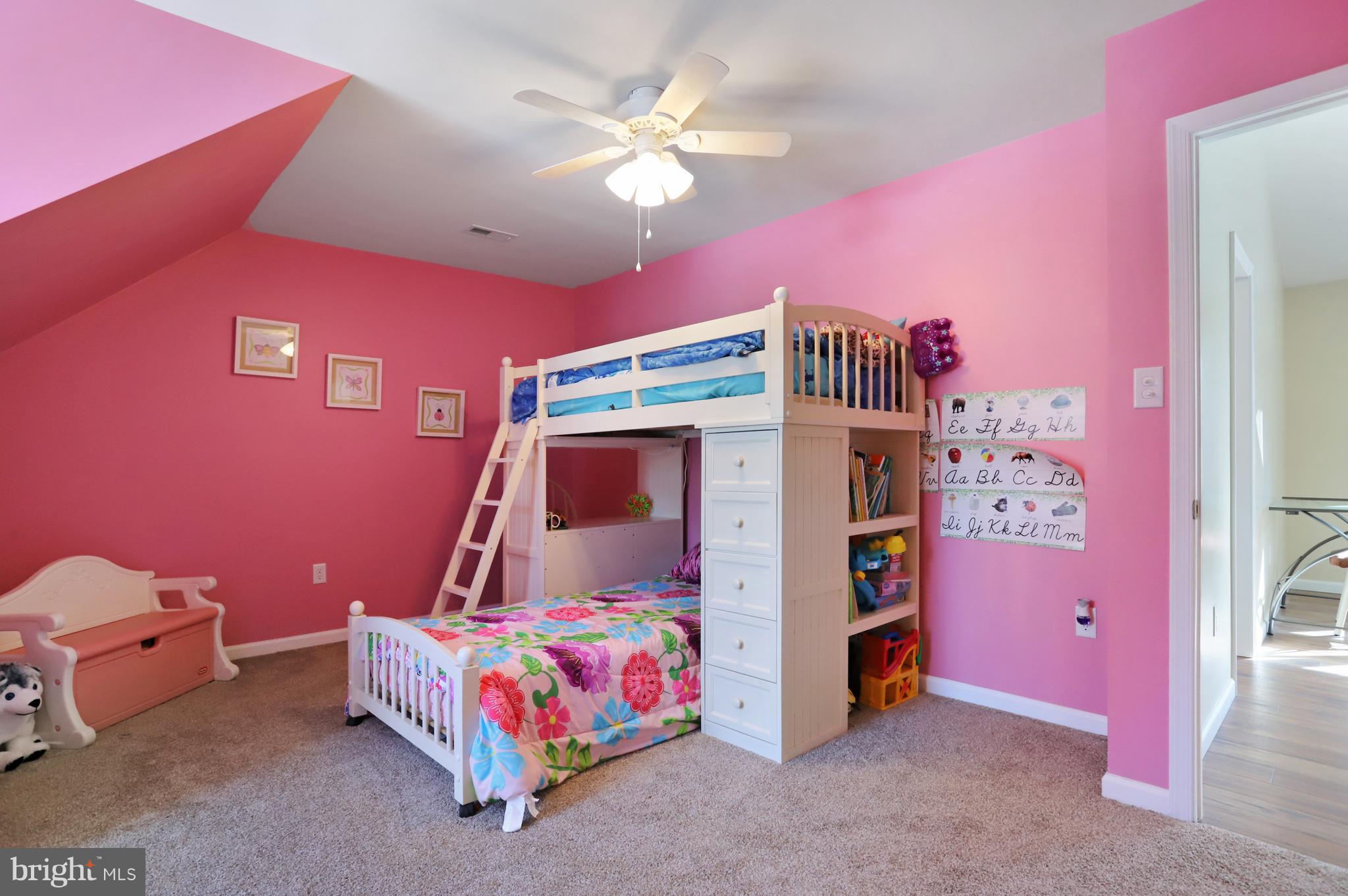 12315 Forrest Hill Road Clear Spring, MD 21722 - Photo 29 of 37 a bedroom with a bed and a chandelier