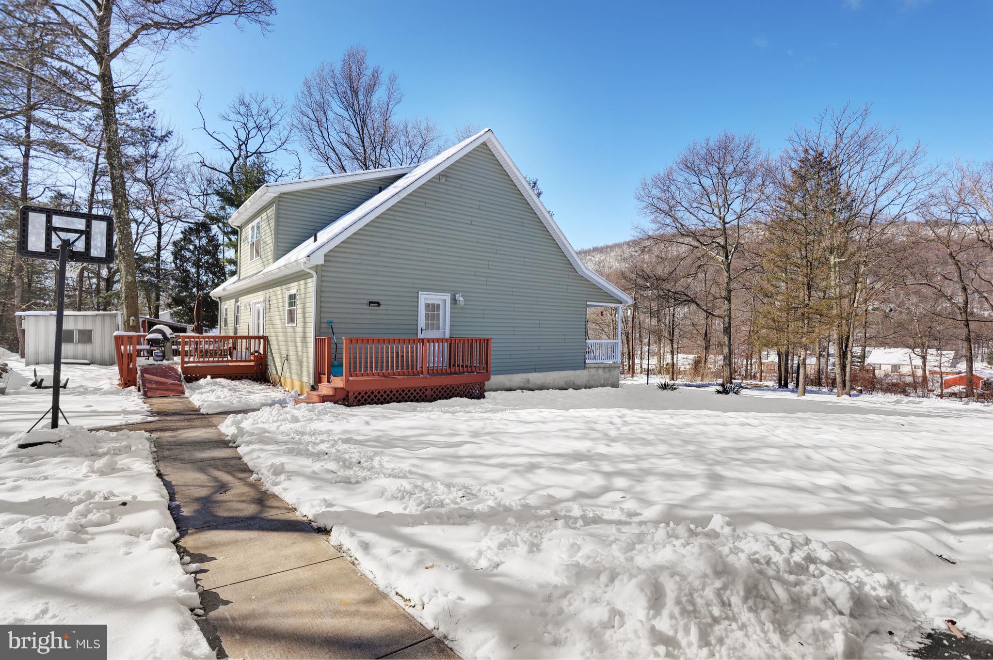 12315 Forrest Hill Road Clear Spring, MD 21722 - Photo 35 of 37 a view of a house with a yard covered in snow