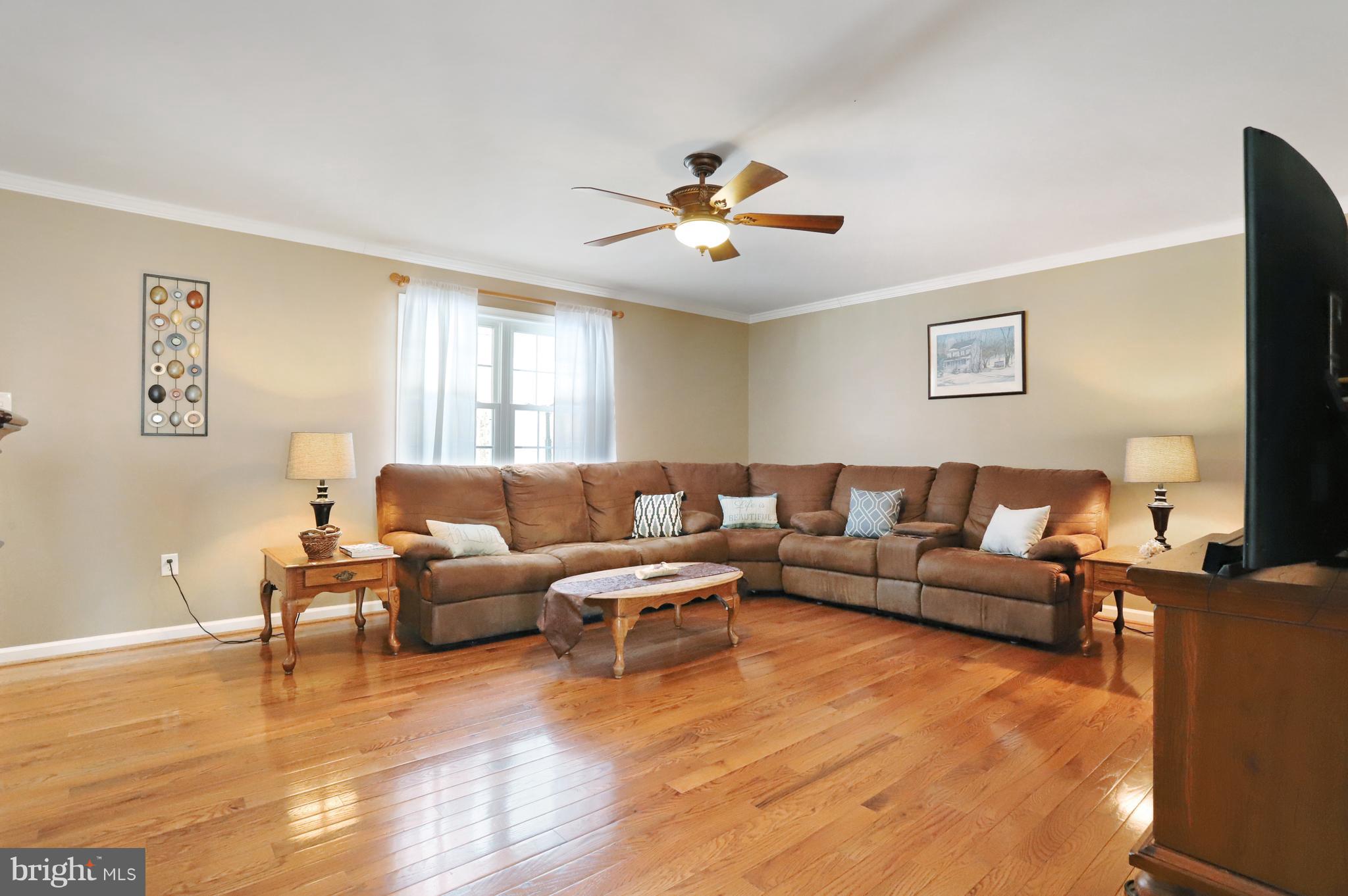 12315 Forrest Hill Road Clear Spring, MD 21722 - Photo 6 of 37 a living room with furniture and a wooden floor