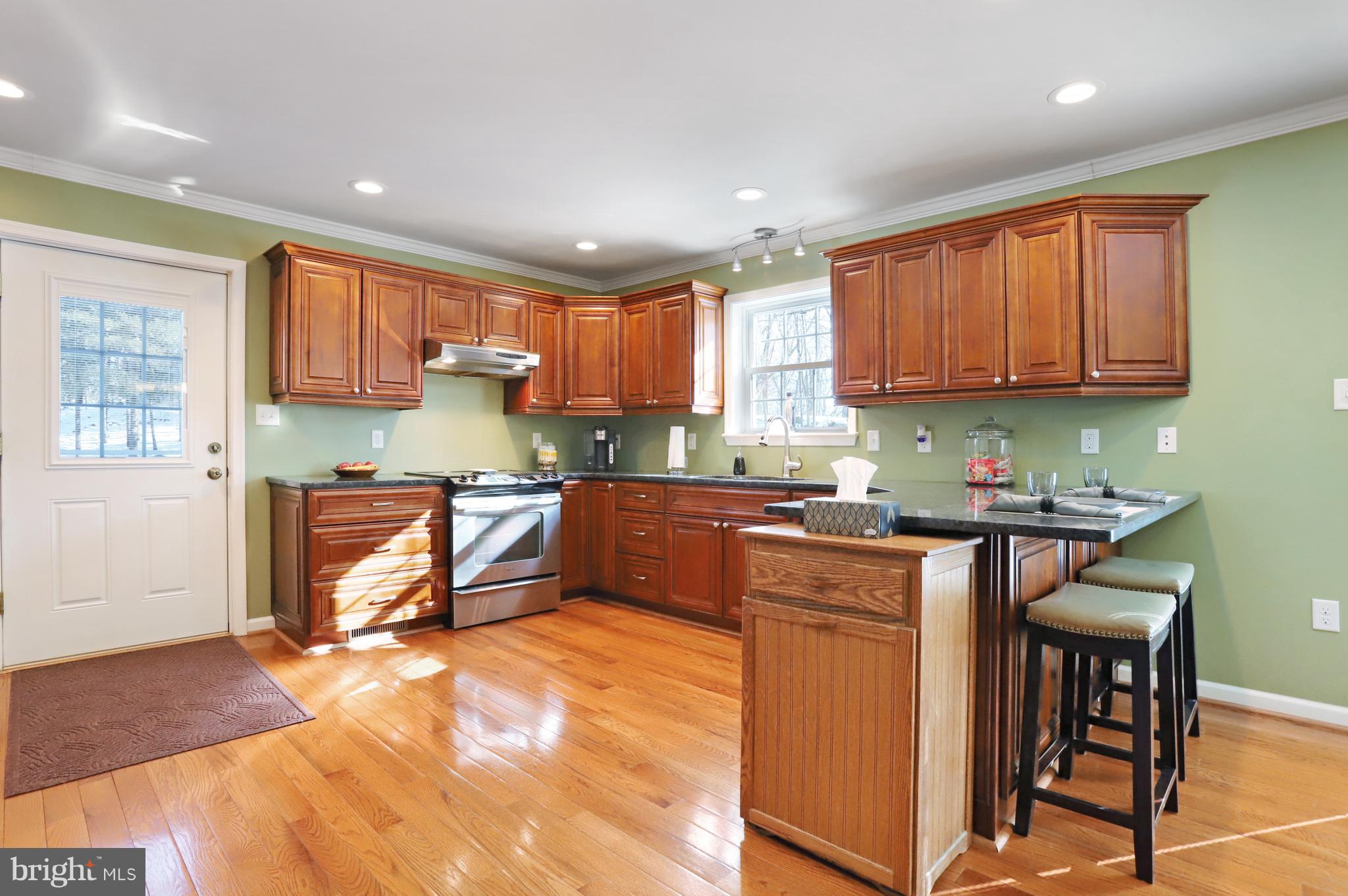 12315 Forrest Hill Road Clear Spring, MD 21722 - Photo 9 of 37 a kitchen with a window a sink and a counter top space