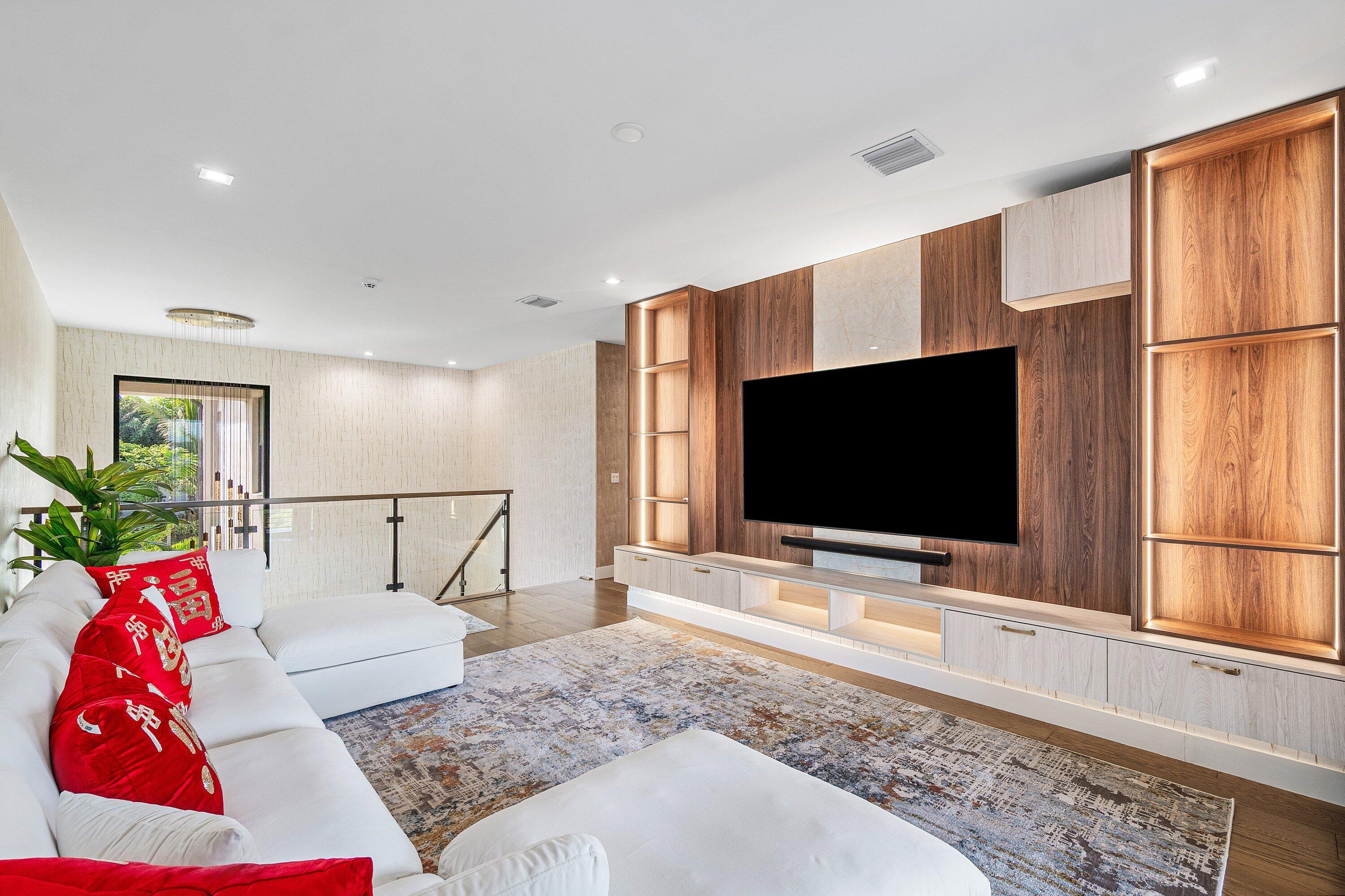 8233 Crystal Downs Avenue Boca Raton, FL 33434 - Photo 27 of 58 a living room with furniture and a flat screen tv
