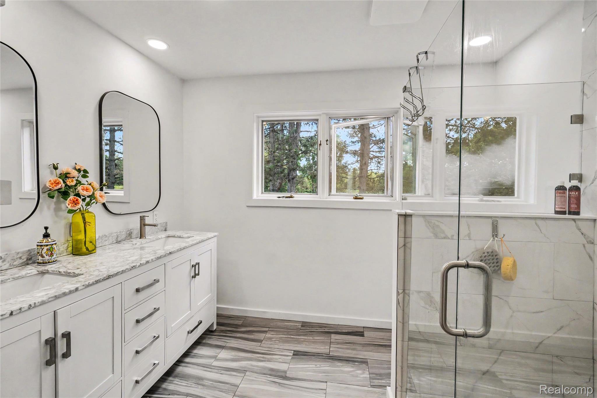 5465 South Lake George Road Metamora, MI 48455 - Photo 25 of 61 Dual vanity with stone countertops and undermount sinks, huge shower