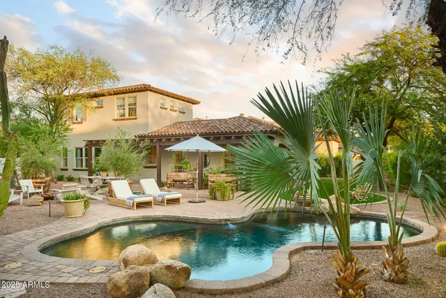 a view of a swimming pool with a patio
