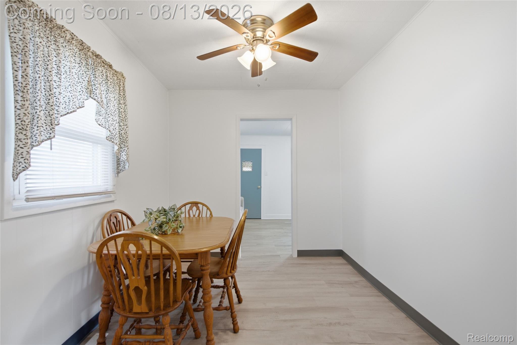 808 Corwin Court Pontiac, MI 48340 - Photo 11 of 33 Light wood-finish flooring, white walls, and an overhead ceiling fan with integrated lighting