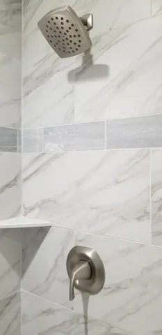 a view of empty room with a fireplace