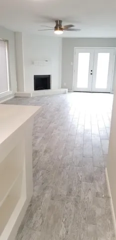 a view of empty room with a fireplace