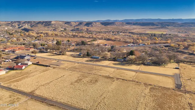 a view of a road with a snow in the background
