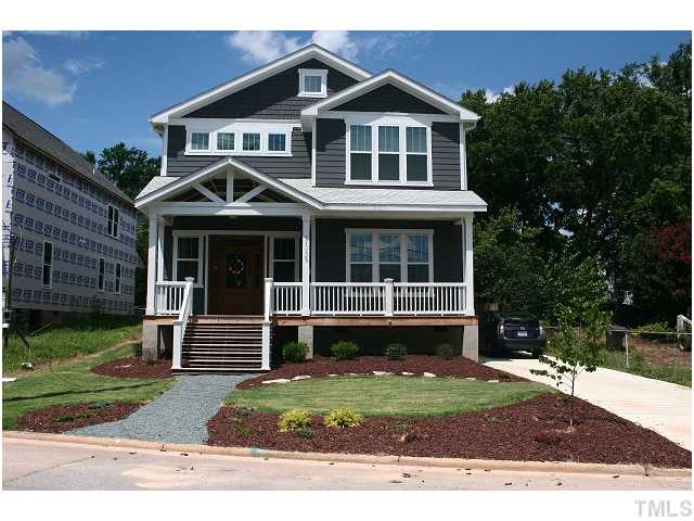 315 Georgetown Road, Unit H Raleigh, NC 27608 - Photo 1 of 20 a front view of a house with a yard