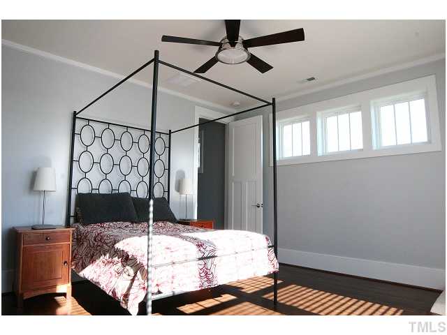 315 Georgetown Road, Unit H Raleigh, NC 27608 - Photo 11 of 20 a bedroom with a bed and a window