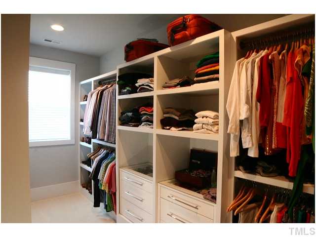 315 Georgetown Road, Unit H Raleigh, NC 27608 - Photo 15 of 20 a view of walk in closet with clothes and shoes