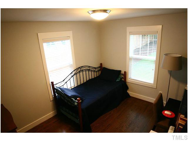 315 Georgetown Road, Unit H Raleigh, NC 27608 - Photo 19 of 20 a living room with furniture and wooden floor