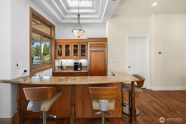 a view of a dining room with furniture and window