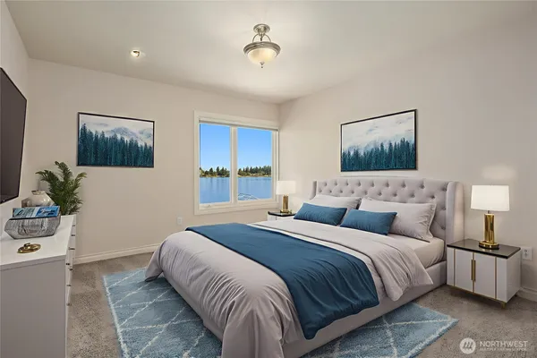 a bedroom with a bed and a painting on the wall