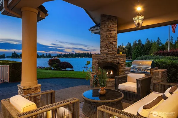 a front view of a house with garden and patio