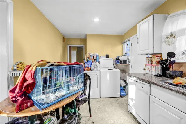 a living room with washer and dryer