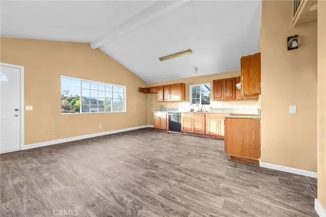 a view of a kitchen with a stove cabinets and wooden floor