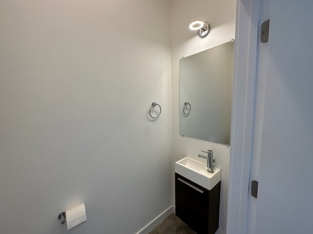 5501 Link Avenue, Unit A Austin, TX 78751 - Photo 14 of 30 a bathroom with a sink a toilet and mirror