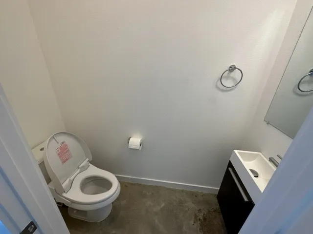 a bathroom with a toilet and a sink