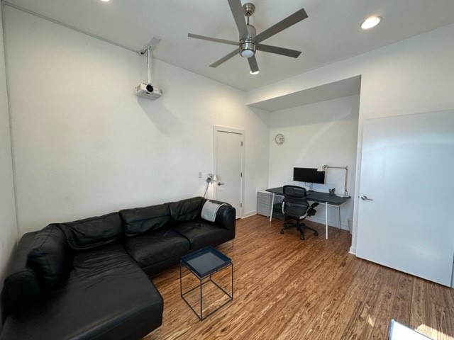5501 Link Avenue, Unit A Austin, TX 78751 - Photo 23 of 30 a living room with furniture and a wooden floor