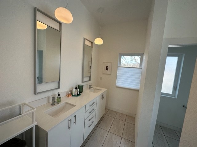 5501 Link Avenue, Unit A Austin, TX 78751 - Photo 27 of 30 a bathroom with a double vanity sink and a mirror