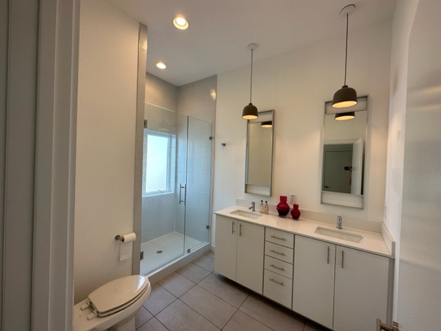 5501 Link Avenue, Unit A Austin, TX 78751 - Photo 30 of 30 a bathroom with a double vanity sink toilet mirror and bathtub