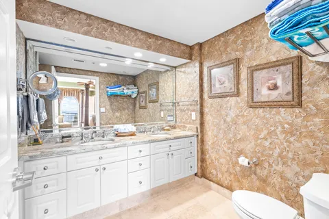 a bathroom with a shower curtain and a sink