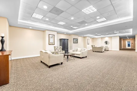 a view of a building with a yard