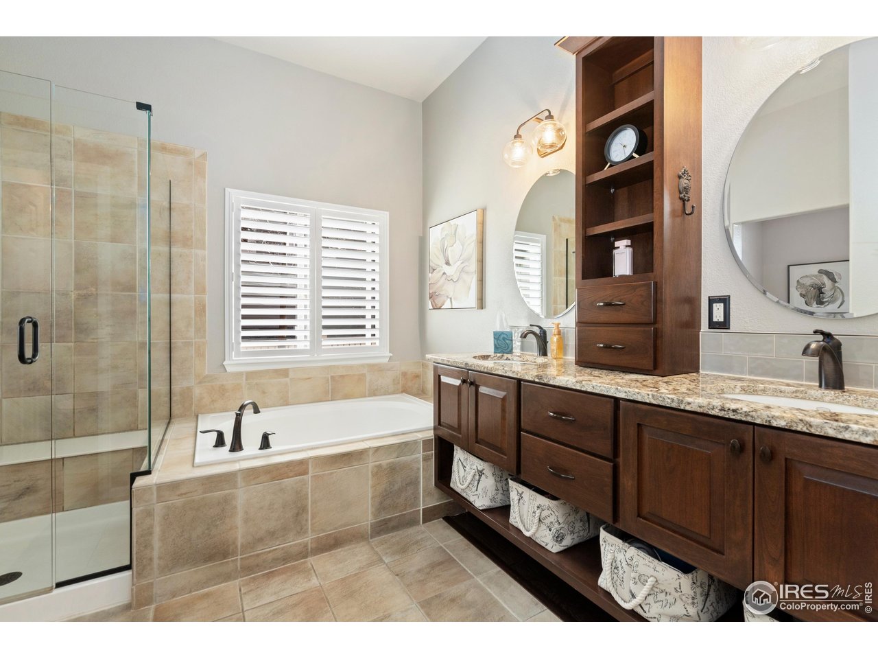 6685 Sage Avenue Firestone, CO 80504 - Photo 16 of 22 a bathroom with a tub sink and mirror