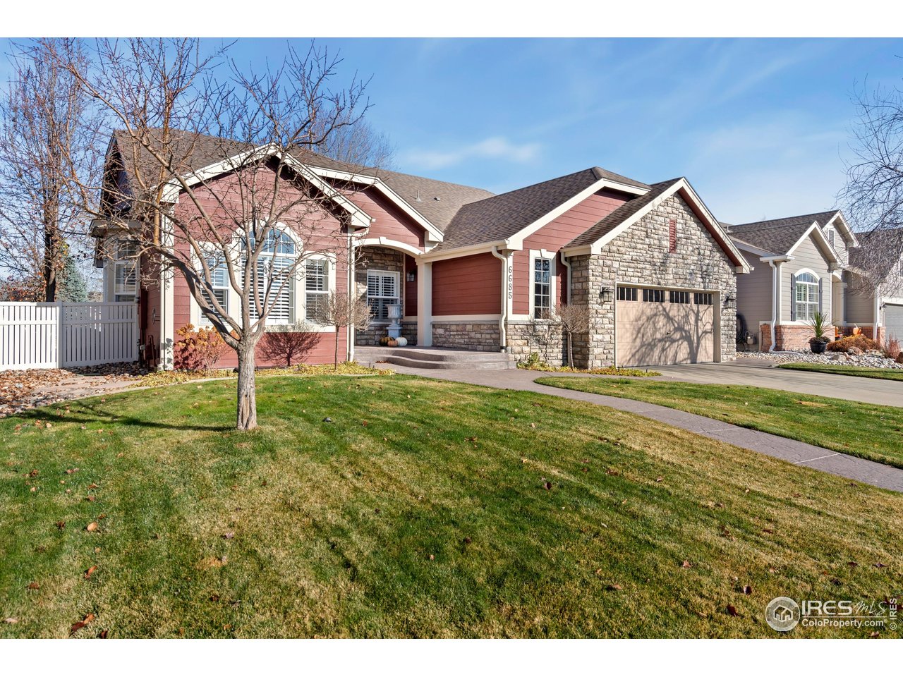 6685 Sage Avenue Firestone, CO 80504 - Photo 2 of 22 a front view of a house with a yard