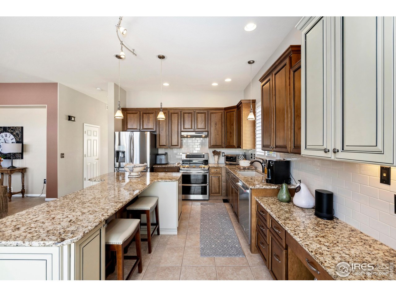 6685 Sage Avenue Firestone, CO 80504 - Photo 9 of 22 a kitchen with counter top space cabinets and stainless steel appliances
