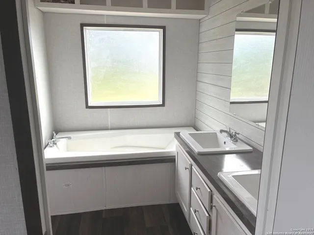 a bathroom with a sink and a vanity