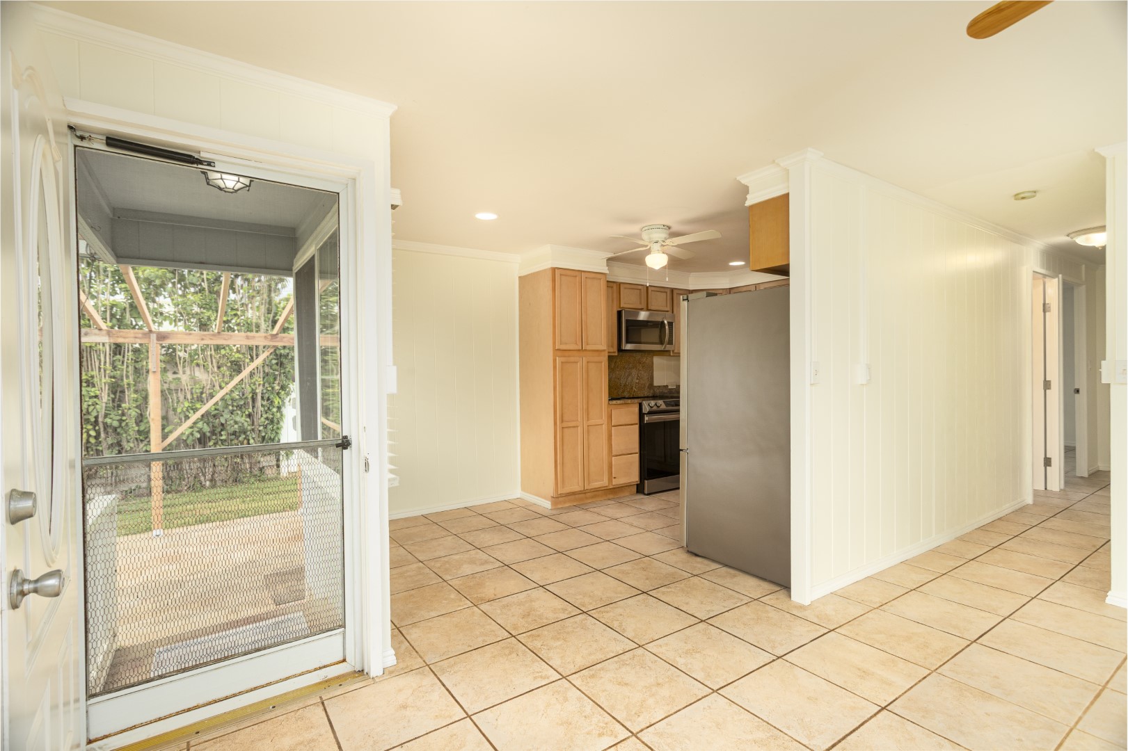 4580 Mamane Street Kapaa, HI 96746 - Photo 3 of 30 a view of a kitchen with a refrigerator and a sink