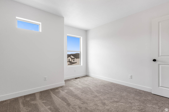 636 West Caroles Way, Unit 7 Tooele, UT 84074 - Photo 21 of 31 Neutral-toned carpeting paired with white walls