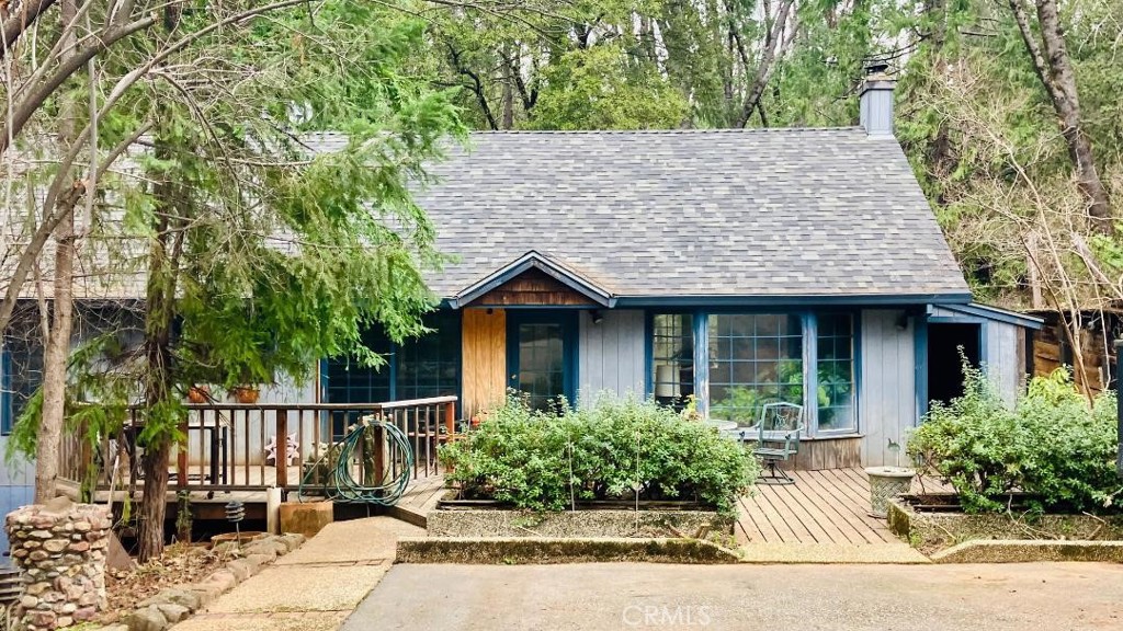 a house with a tree in front of it