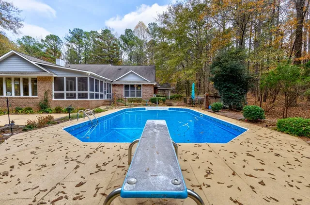a view of a swimming pool with a patio