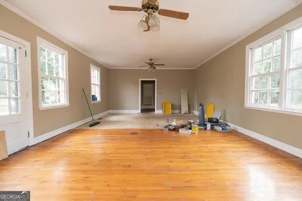 a view of a livingroom with a window and couch