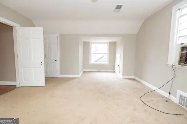 an empty room with windows