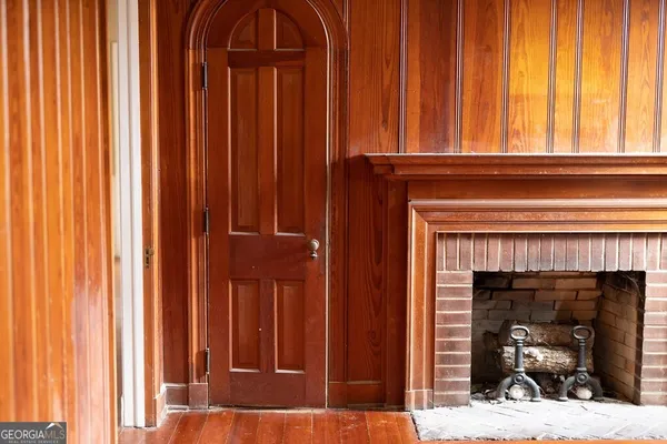 a view of living room with a fireplace and a window