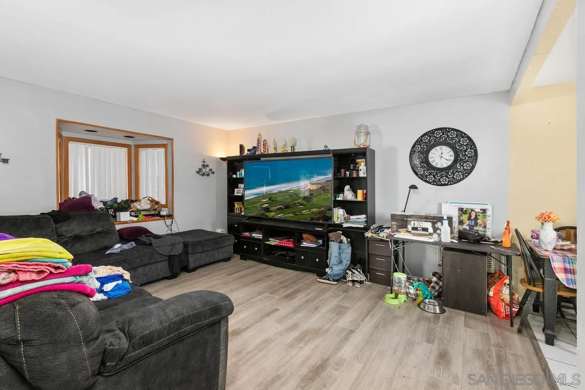 9136 Northcote Road Santee, CA 92071 - Photo 2 of 10 a living room with furniture and a flat screen tv
