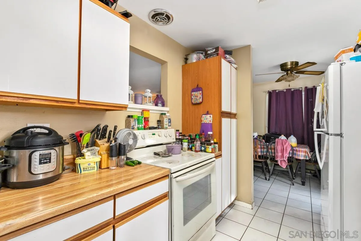 9136 Northcote Road Santee, CA 92071 - Photo 5 of 10 a kitchen with a sink and a stove top oven