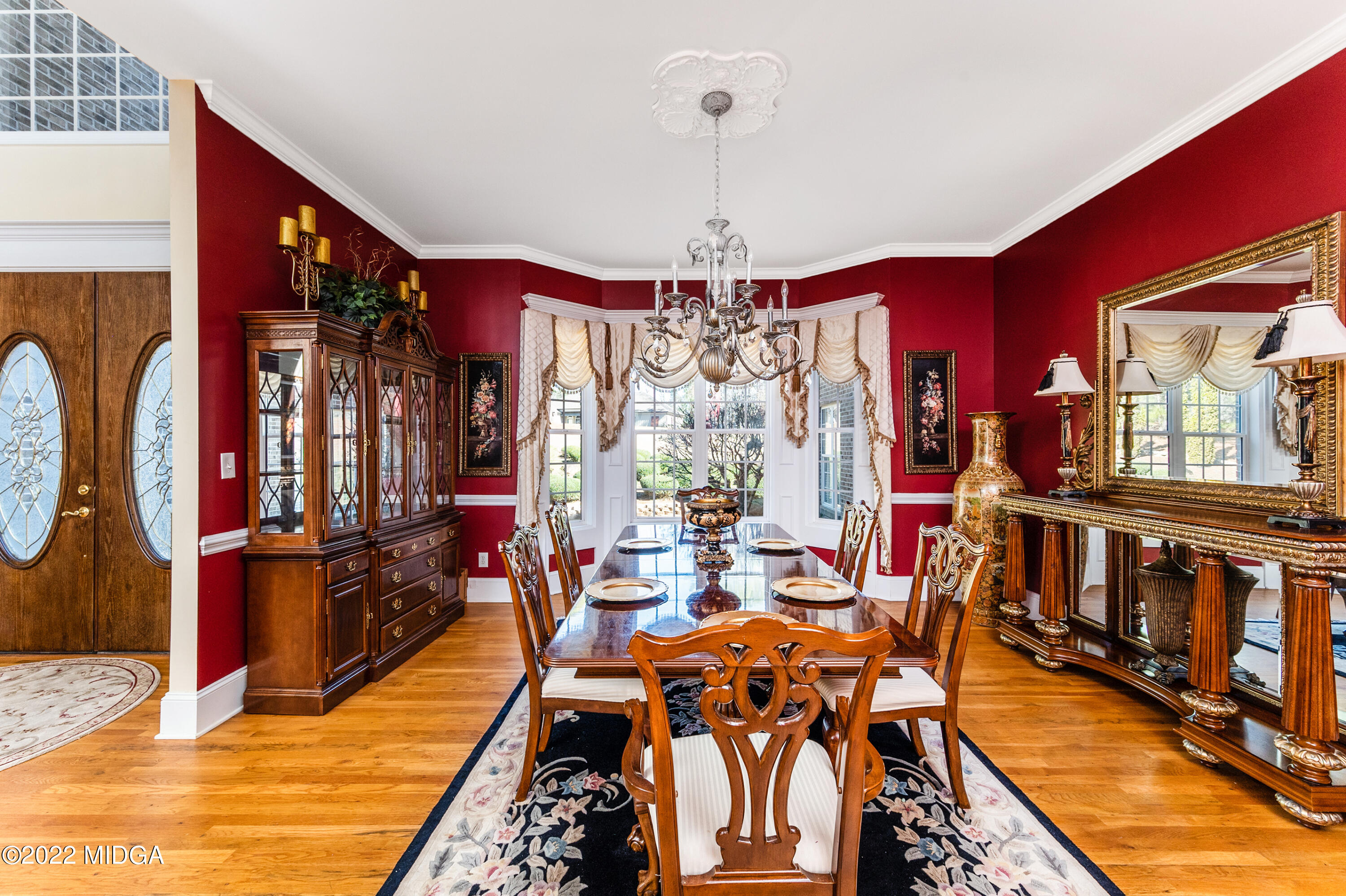 176 Tumbling Shoals Drive Gray, GA 31032 - Photo 20 of 51 a view of a dining room with furniture window and wooden floor