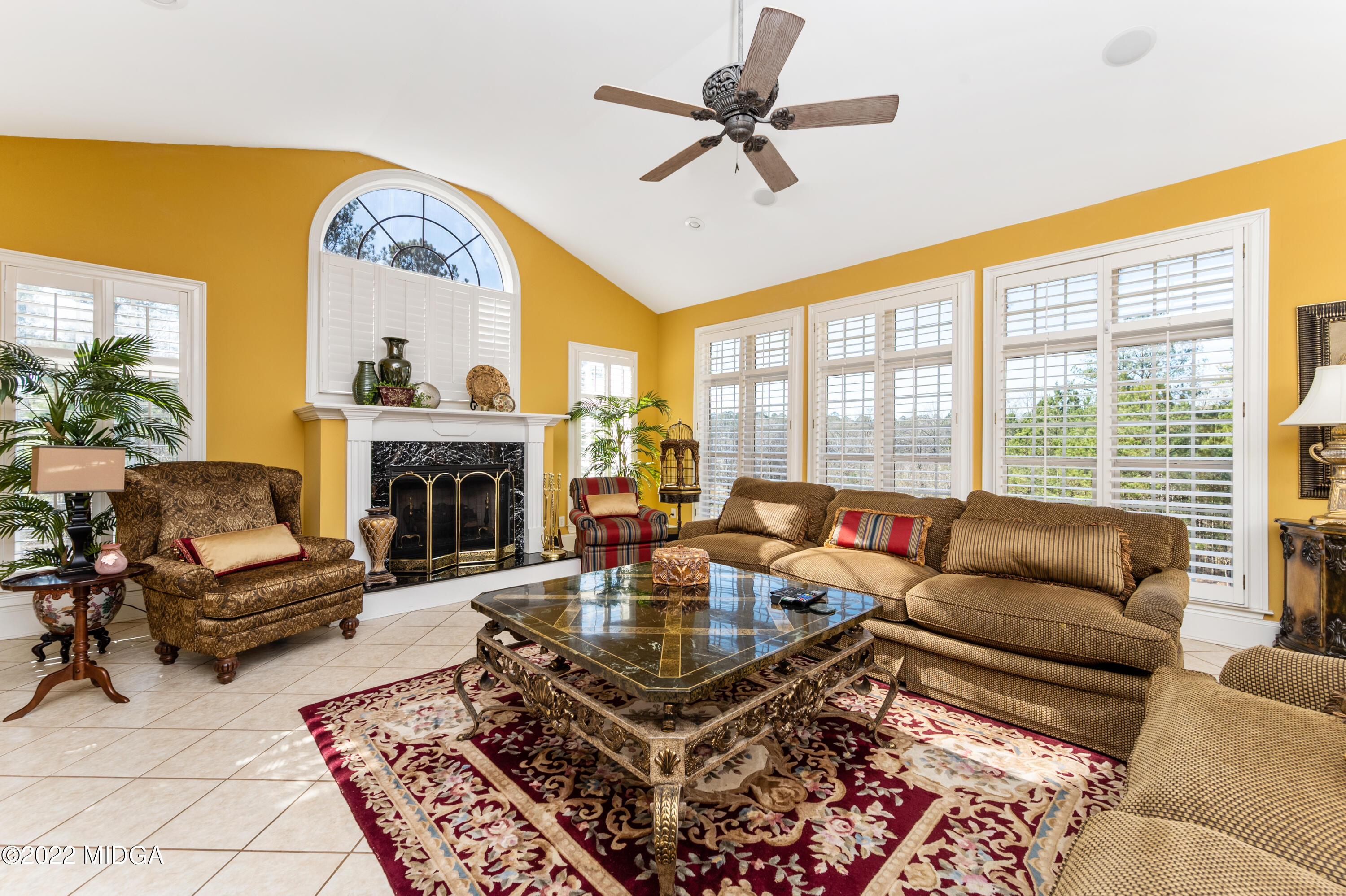 176 Tumbling Shoals Drive Gray, GA 31032 - Photo 27 of 51 a living room with furniture a fireplace and a large window