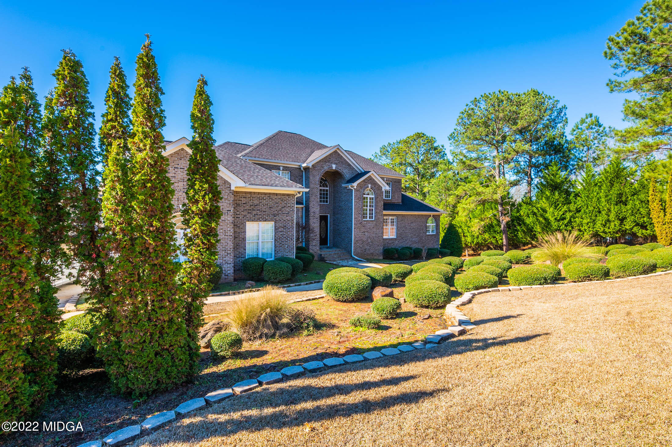 176 Tumbling Shoals Drive Gray, GA 31032 - Photo 3 of 51 a front view of a house with a yard and trees